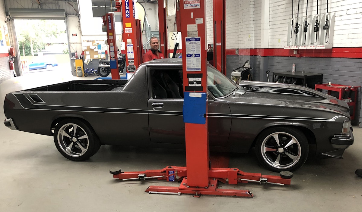 Another classic vehicle, a Holden Utility 1979. It has been heavily modified. One of our experienced technicians, Brad, is in the background admiring this cool car.